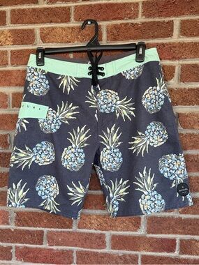 Rip Curl Men’s Pineapple Print Swim Trunks in Navy and Mint. 32